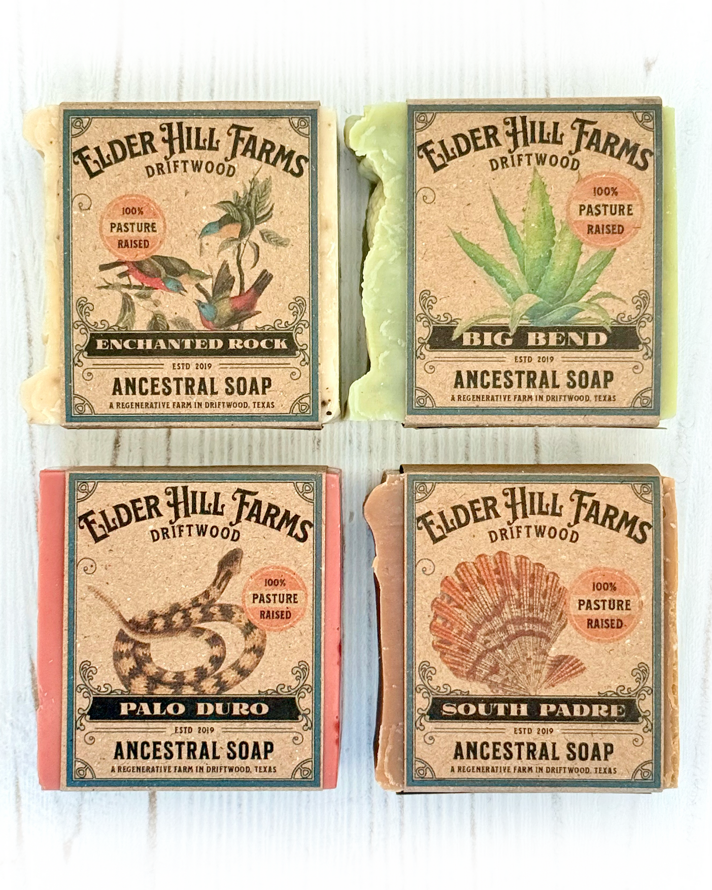 Four packages of Elder Hill Farms soap on a white background