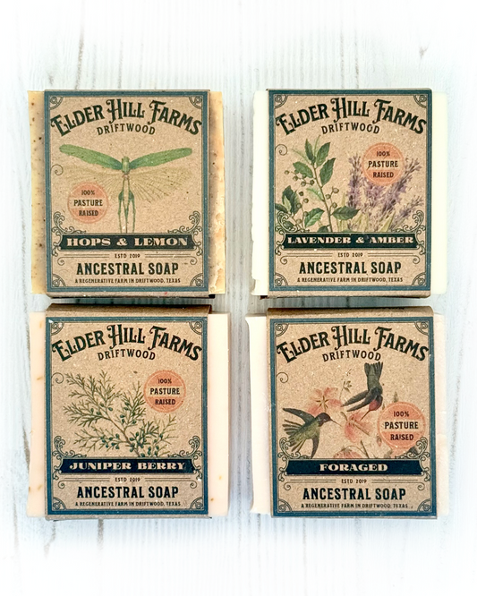 Four packages of Elder Hill Farms soap on a white background