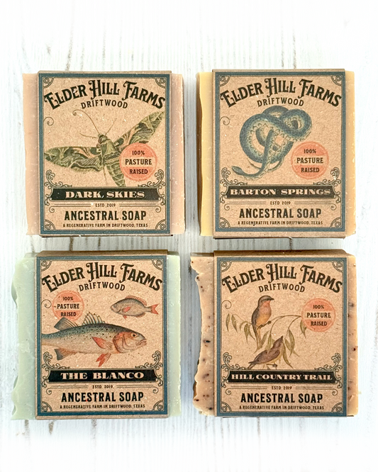 Four packages of Elder Hill Farms Driftwood soap on a white background