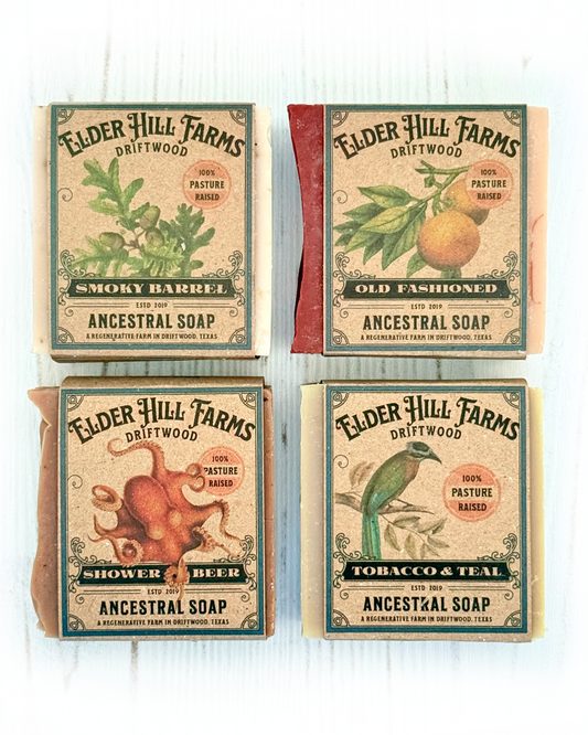 Four packages of Elder Hill Farms soap on a white background